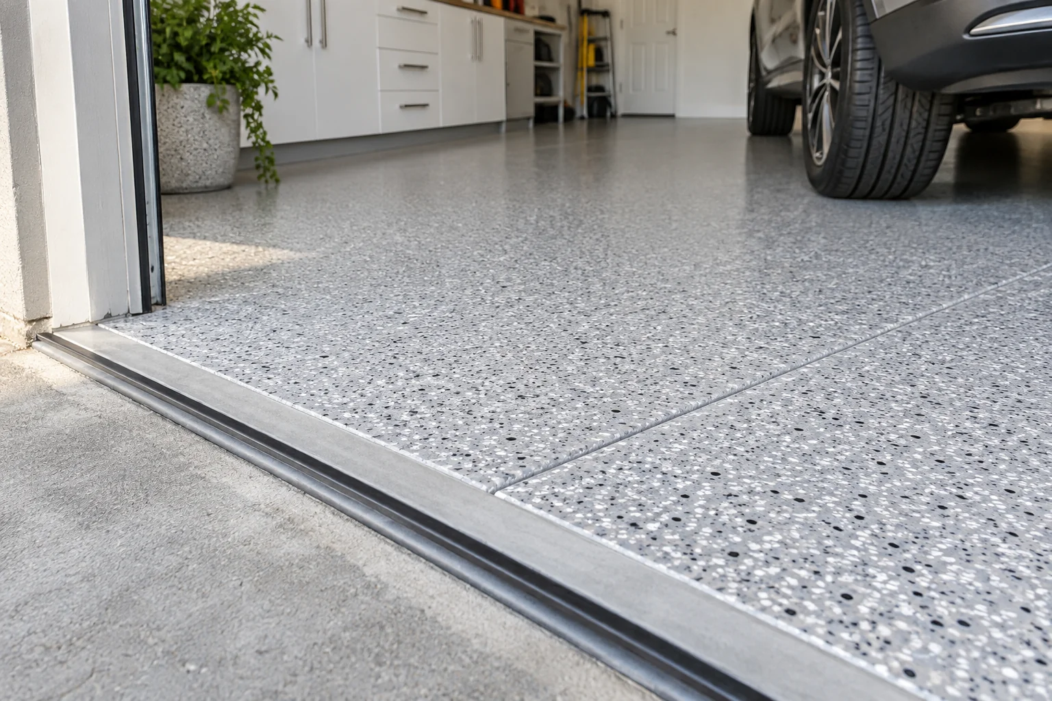 A garage threshold, tyre contact area and retained joint illustrate details that deserve attention before the decorative finish is chosen.